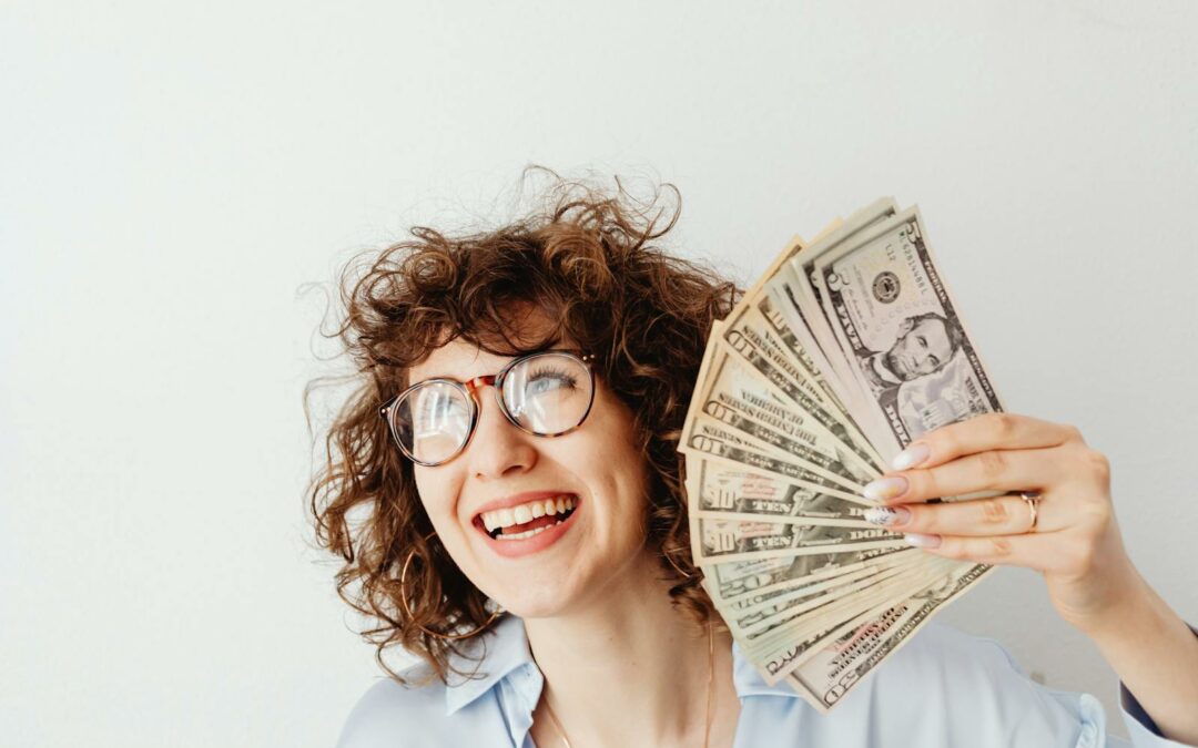 A Woman Holding Us Dollar Bills