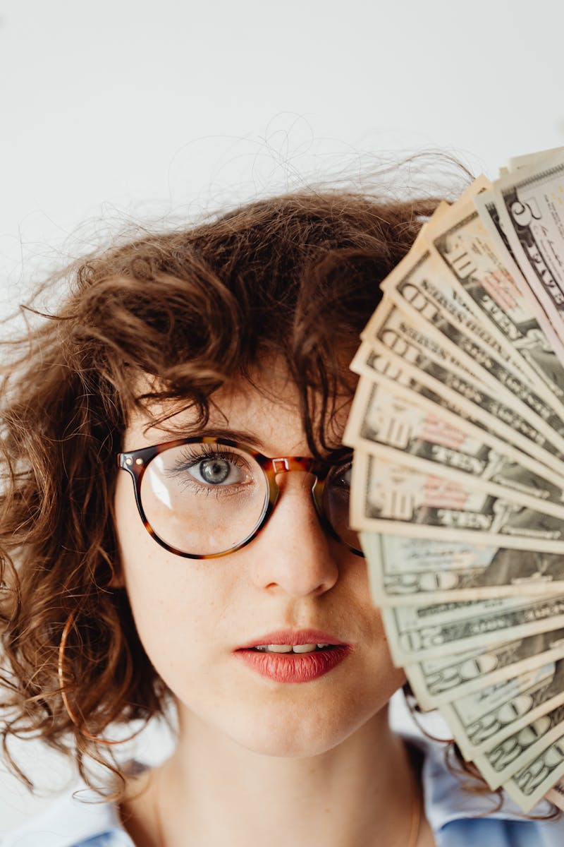 Woman's Face Beside Us Dollar Bills